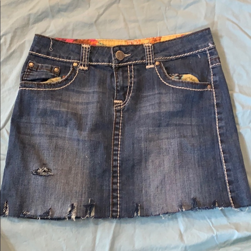 Ripped and frayed denim skirt